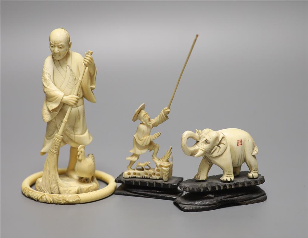 A Japanese carved ivory figure, male with brush, Meiji period, an elephant, a fisherman and a bangle